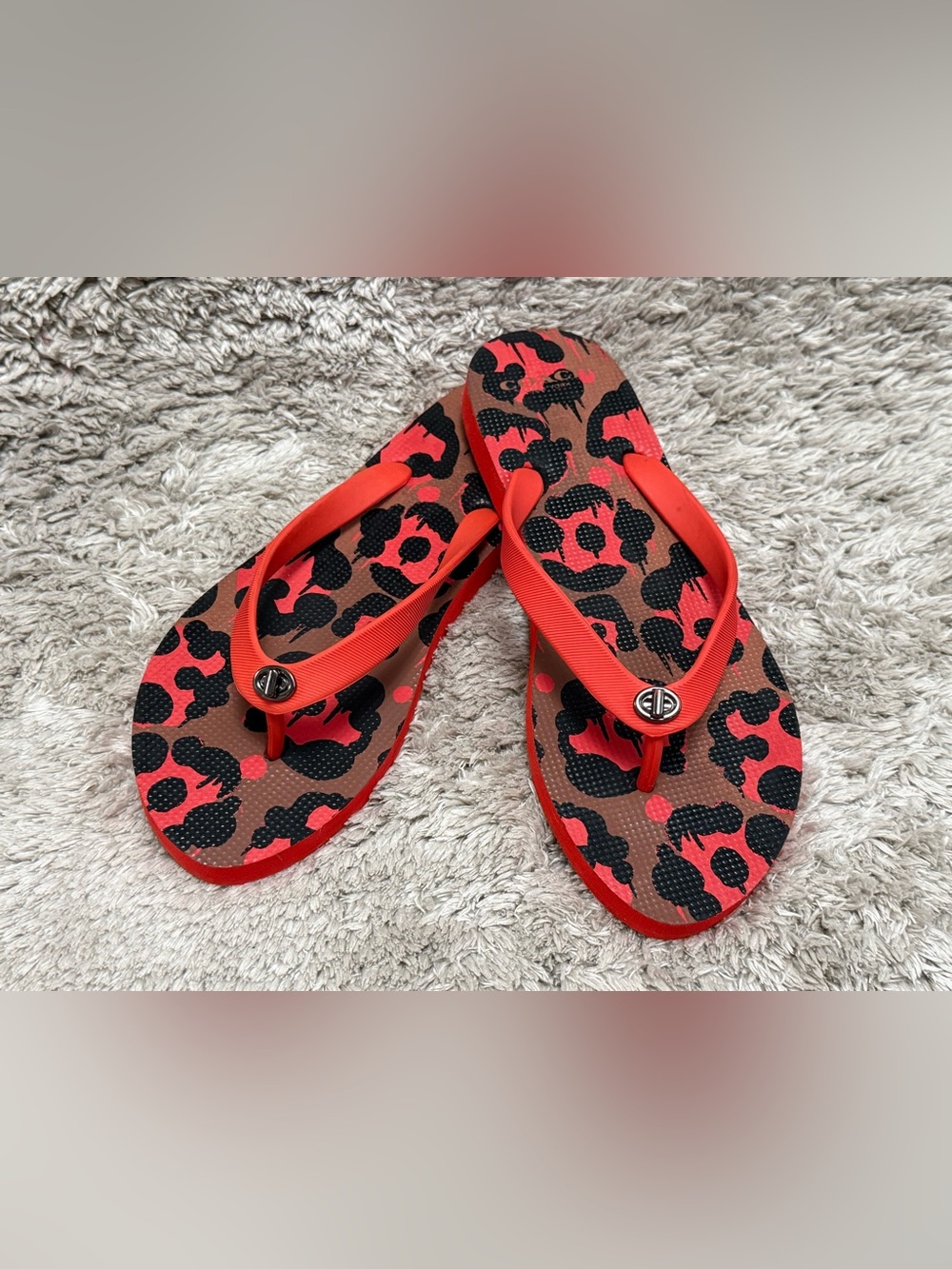 COACH Women’s Orange Leopard Print Flip Flops